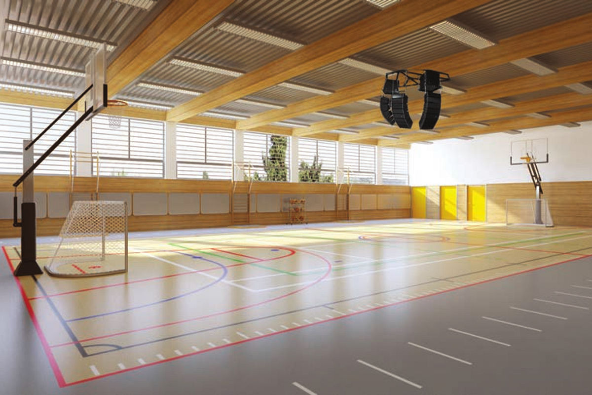 Education sound systems by TOA Canada a representative photo from a school gym with large sound system speakers hanging from the ceiling.